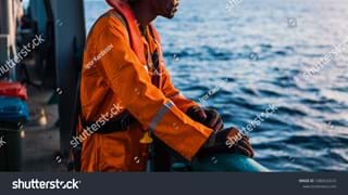 stock-photo-seaman-ab-or-bosun-on-deck-of-vessel-or-ship-wearing-ppe-personal-protective-equipment-helmet-1086532610.jpg